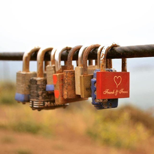 Love locks on perimeter rope at Golden Gate Bridge North